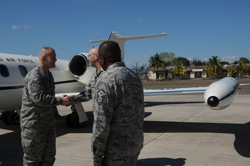 SOTO CANO AIR BASE, Honduras -- Chief Master Sgt. of the Air Force James Roy is greeted to Soto Cano Air Base Jan. 30 by the 612th Air Base Squadron Senior Enlisted Leader, Chief Master Sgt. Thomas Schwenk and the 612th ABS first sergeant, Master Sgt. Emmit Bartee. During Chief Roy's visit to Soto Cano, he toured many facilities, conducted meet-and-greets and spoke with Airmen about key focuses in the Air Force today. (U.S. Air Force photo/Staff Sgt. Kimberly Rae Moore)