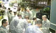 Airmen from the 916th Air Refueling Wing's First Sergeant Council, in addition to several logistics and communication Airmen prepare 'welcome home' kits for deployers returning from the wing's operational readiness inspection. (USAF photo by MSgt. Shane Lynch, 916CS)