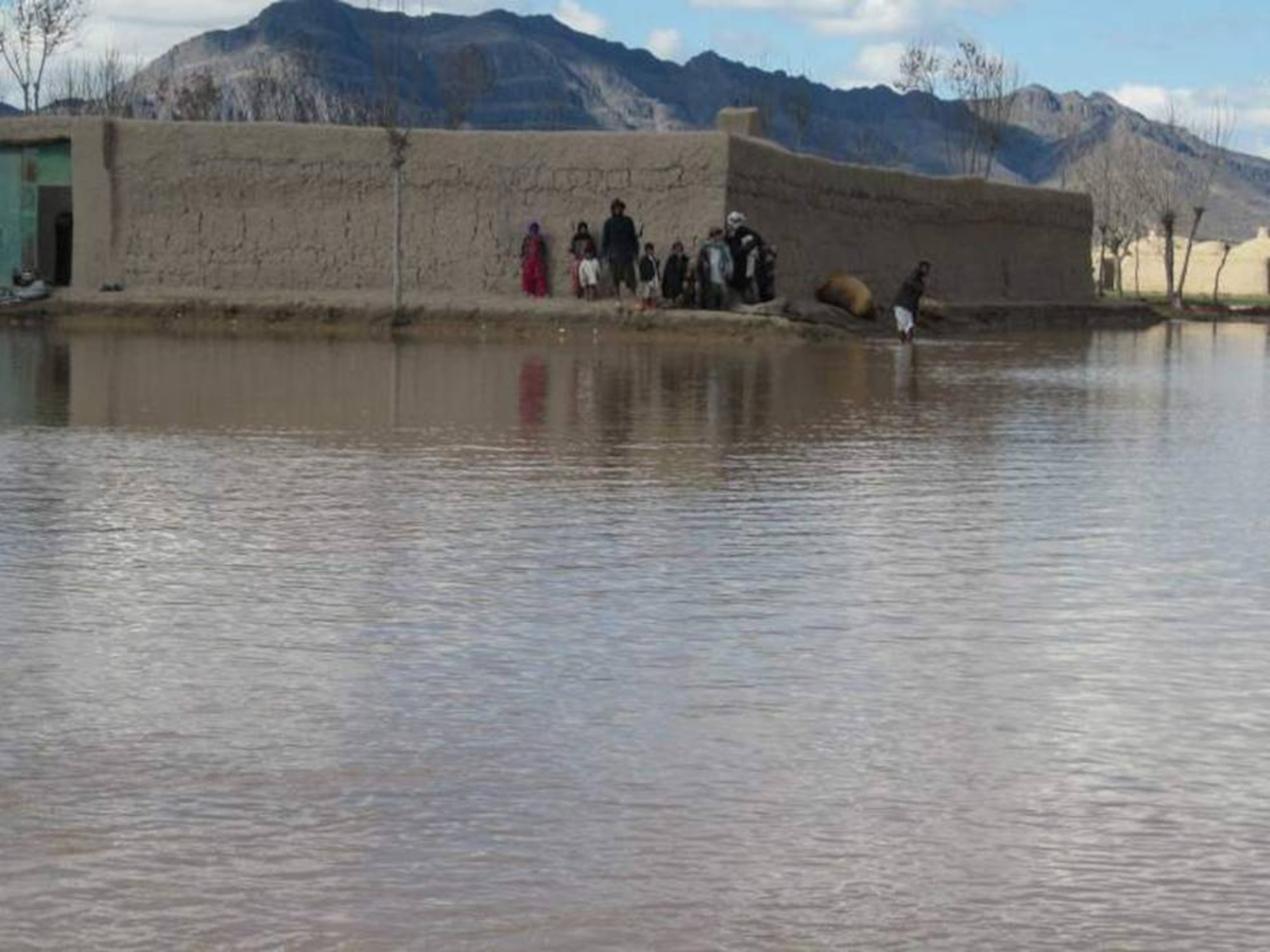 ZERKO VALLEY, Afghanistan – Afghan villagers affected by the flood in the Herat and Shindand district area Feb. 4th. (U.S. Air Force photo)