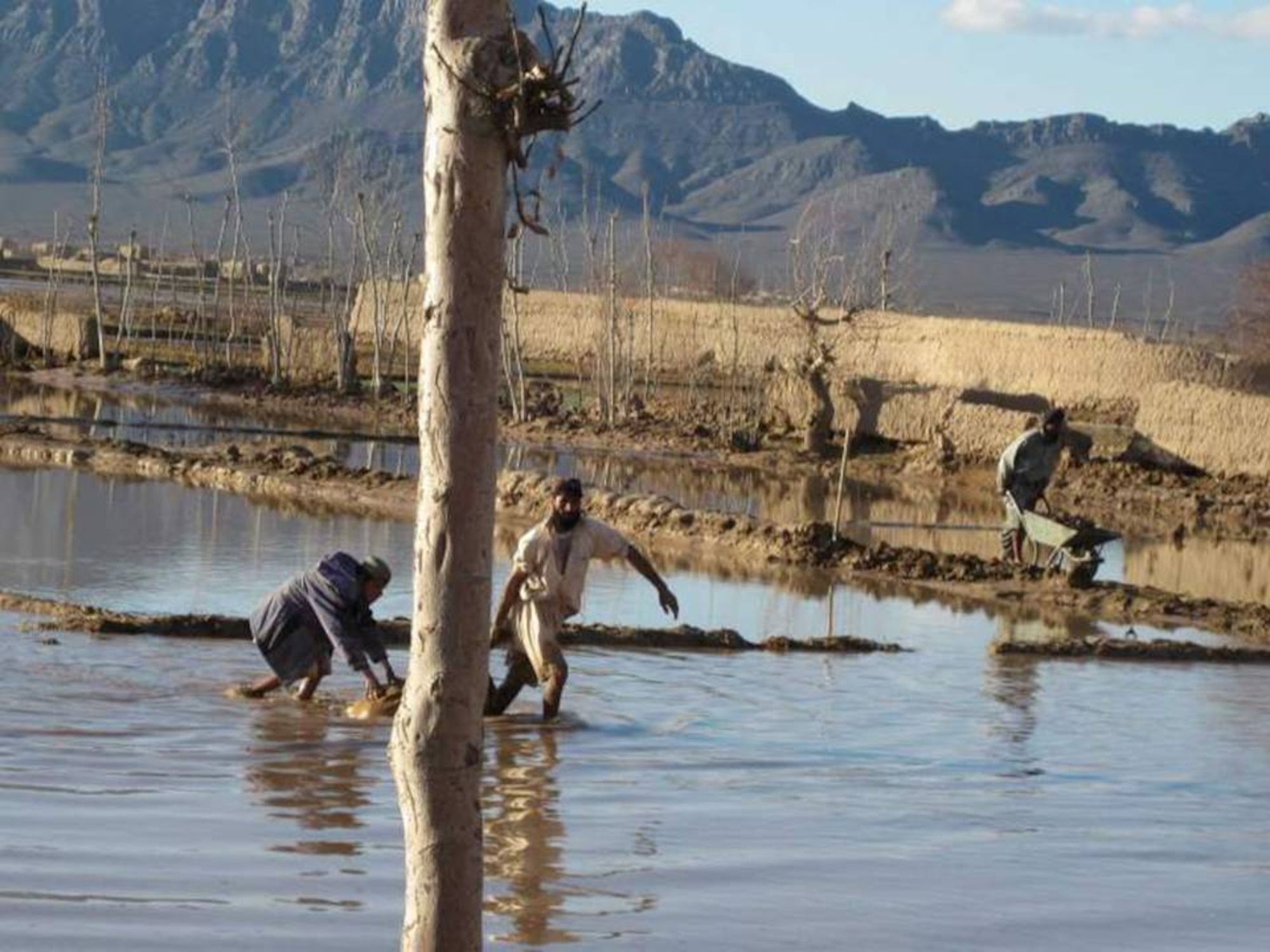 ZERKO VALLEY, Afghanistan – Afghan villagers affected by the flood in the Herat and Shindand district area Feb. 4th. (U.S. Air Force photo)