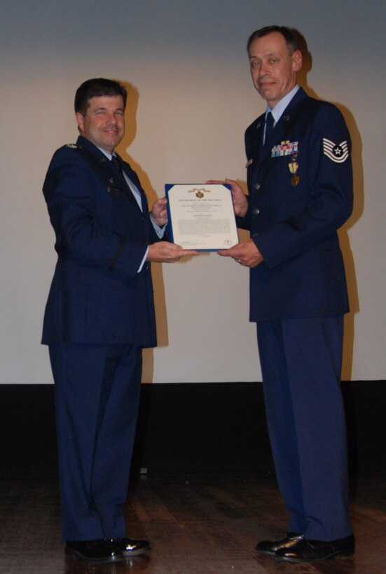 Tech. Sgt. Daniel Oliver was given an Air Force commendation medal for his Air Force Reserve Command service by the 932nd Airlif Wing commander, Col. William Edwards, Jr.  Sergeant Oliver is a writer and photographer for the wing located near Belleville, Ill.