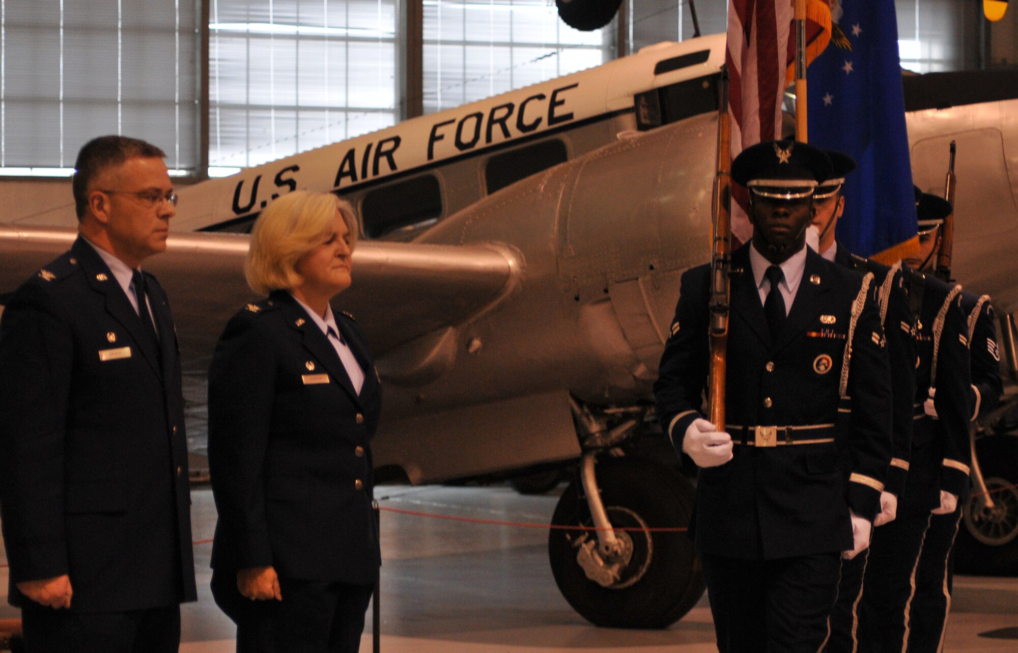 Col. Randal L. Bright, 512th Airlift Wing commander, and Col. Elaine K. Barron, 512th Mission Support Group commander, stand at attention as the 512th AW honor guard proceeds forward while bearing the United States and Air Force flags during Colonel Barron's retirement ceremony Feb. 5 at the Air Mobility Command Museum, Dover Air Force Base, Del. Colonel Barron said farewell after a 31-year career, serving in both the active-duty and Reserve Air Force. (U.S. Air Force photo by Staff Sgt. Andria J. Allmond/Released)