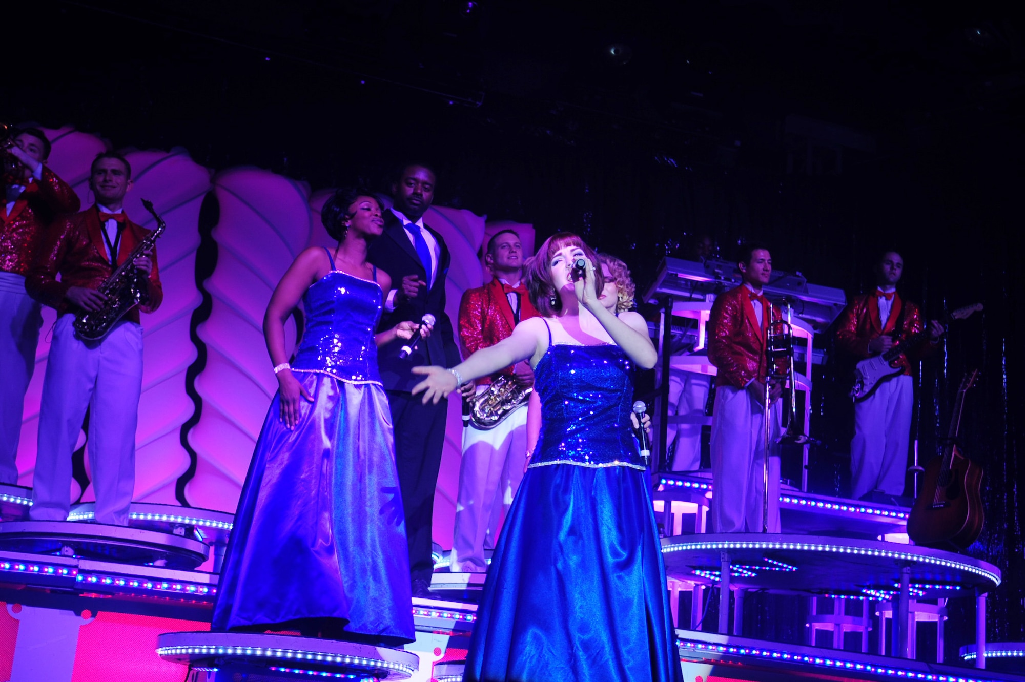 Airman 1st Class Jette Warnick sings during a Tops In Blue performance February 3, 2011, Eielson Air Force Base, Alaska . Tops In Blue inspired Eielson Airmen with a high-impact, high-energy performance. Airman Warnick is a singer for Tops In Blue. (U.S. Air Force photo/Airman 1st Class Laura Goodgame)