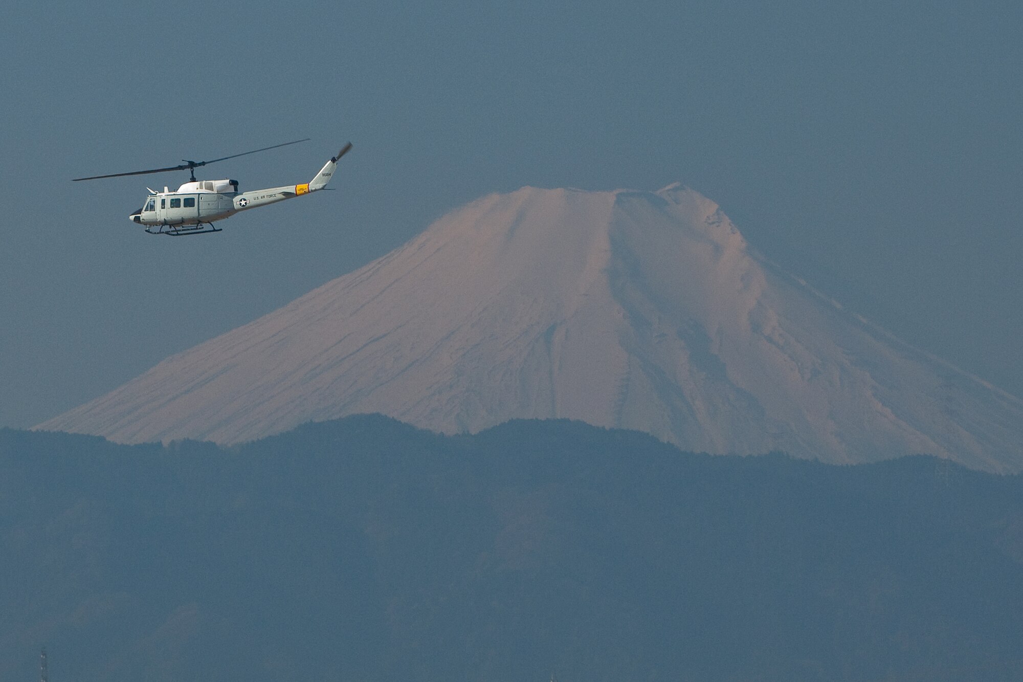 YOKOTA AIR BASE, Japan -- A UH-1 Huey helicopter assigned to the 459th Airlift Squadron participates in an Emergency Management Exercise here Feb. 4. (U.S. Air Force photo/Osakabe Yasuo)