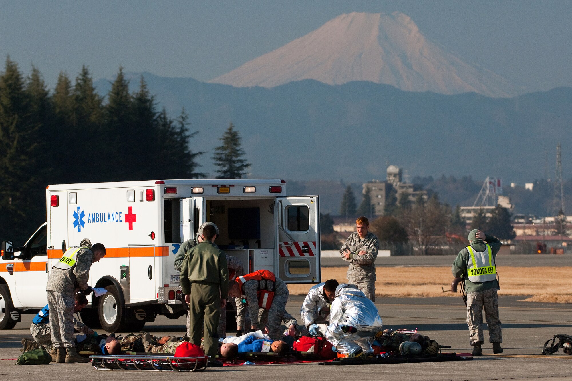 YOKOTA AIR BASE, Japan -- Members from the 374th Civil Engineer Squadron fire department and the 374th Medical Operations Squadron perform triage during an Emergency Management Exercise here Feb. 4. (U.S. Air Force photo/Osakabe Yasuo) 