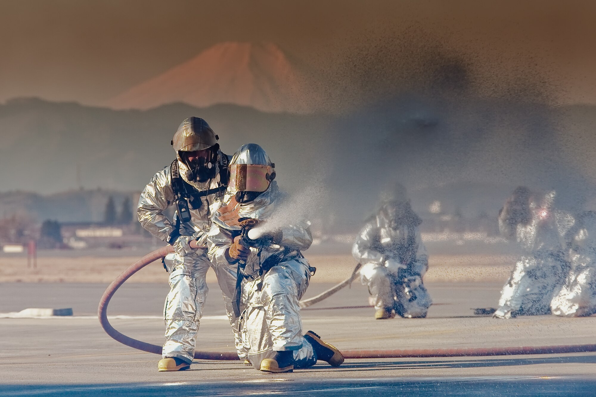 YOKOTA AIR BASE, Japan -- Yokota firefighters put out a simulated aircraft fire during an Emergency Management Exercise here Feb. 4. (U.S. Air Force photo/Osakabe Yasuo) 