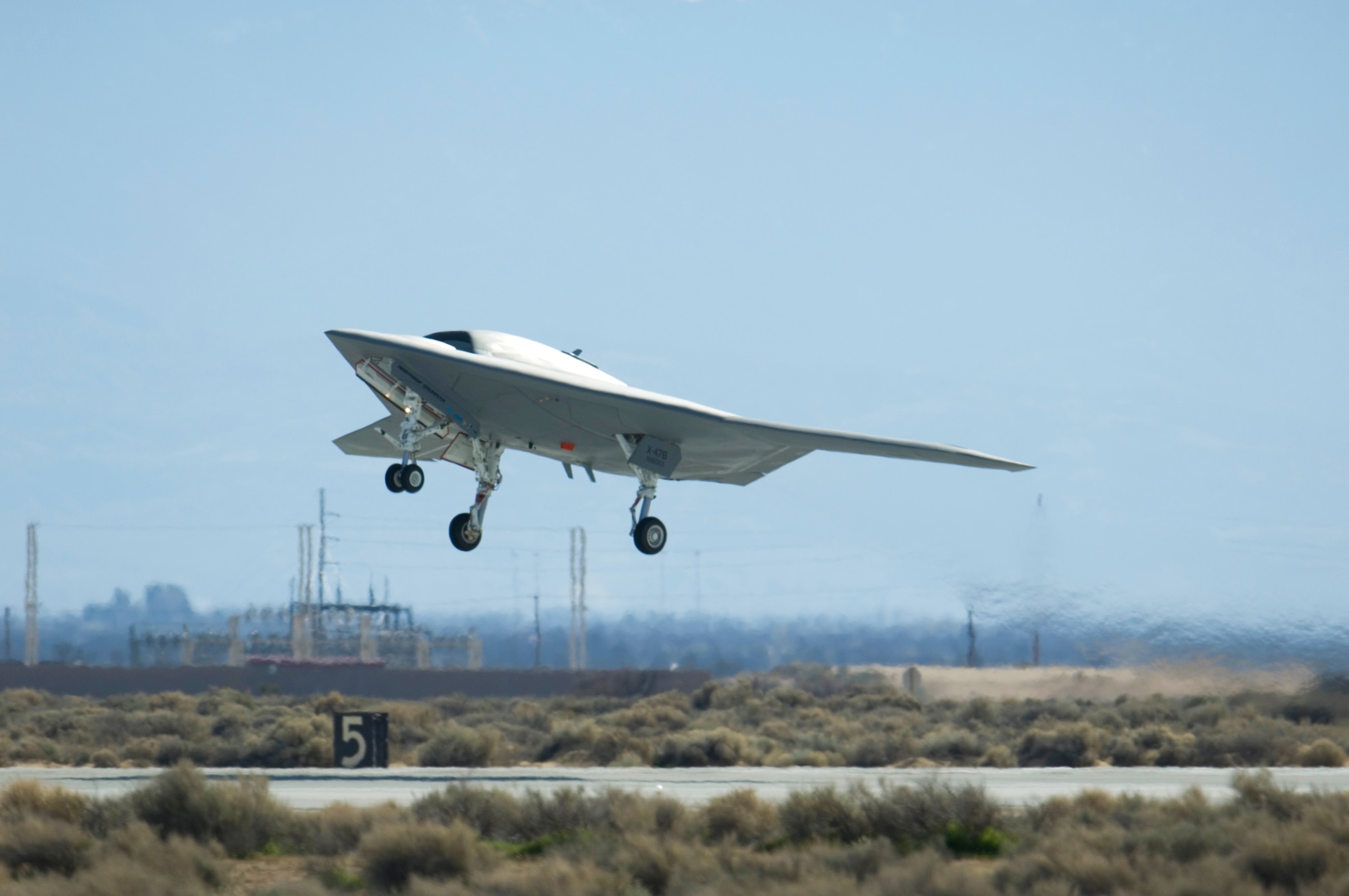 A Navy X-47B Unmanned Combat Air System Demonstration aircraft takes off and flies for the first time Feb. 4, 2011, at Edwards Air Force Base, Calif. The Northrop Grumman-built aircraft flew for 29 minutes during the flight test. (U.S. Air Force photo/Rob Densmore)