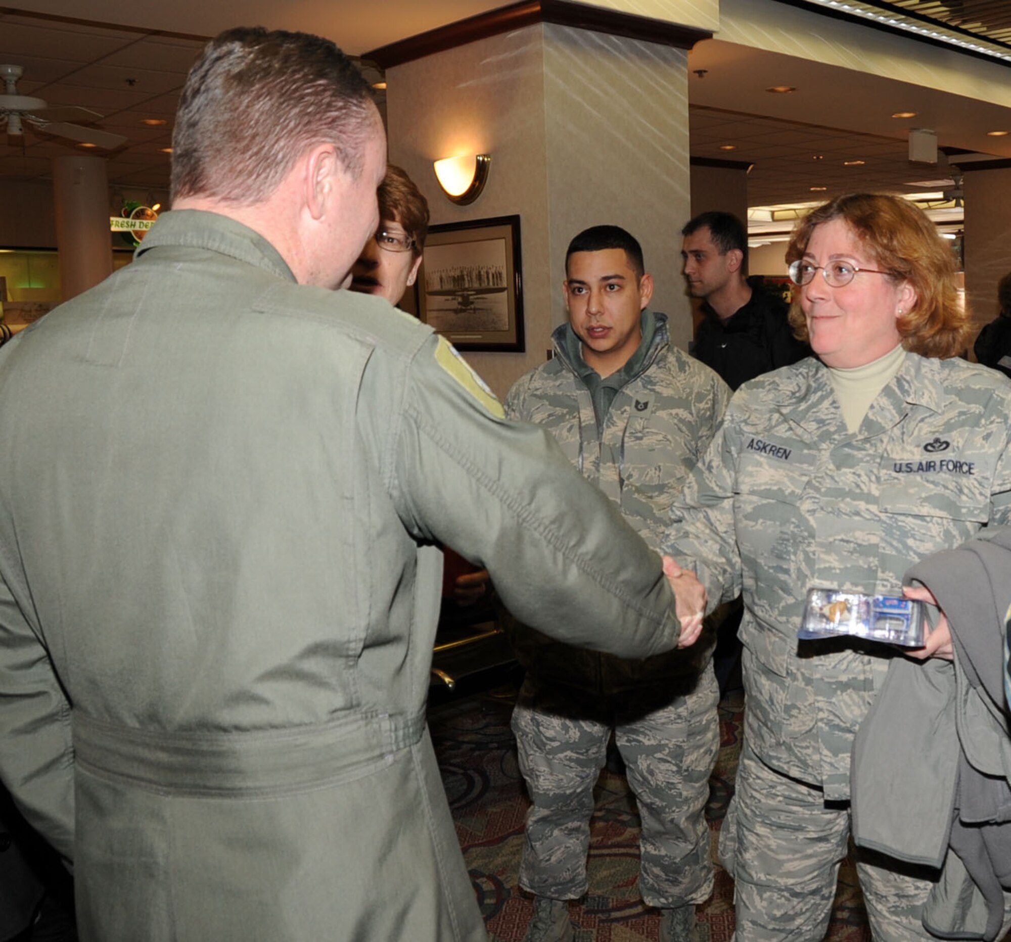 Senior Master Sgt. Tamera S. Askren of the 931st Civil Engineering Squadron is greeted by Col. Daniel "Rock" Heires, deputy commander, 931st Air Refueling Group upon her return from a deployment in Southwest Asia, Feb. 4. Members of the 931st ARG showed up at the Midcontintinental Airport in Wichita to support Sergeant Askren and five other reservists from the 931st CES. (Air Force Photo by Tech. Sgt. Brannen Parrish)