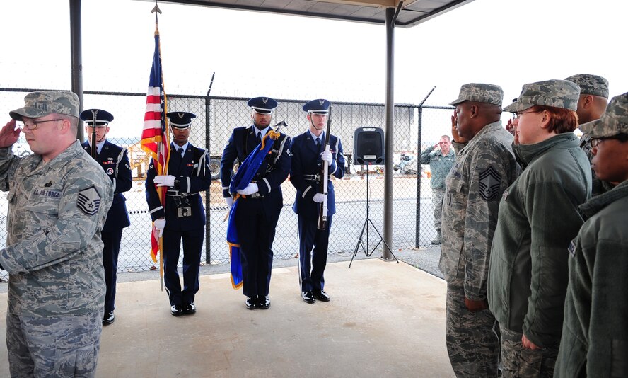 MOODY AIR FORCE BASE, Ga.-- Members of the Moody Air Force Base Honor Guard post the colors for the ribbon-cutting ceremony of the Turn-n-Burn Flight Kitchen Feb. 7. Members in attendance at the ceremony pay their respect to the flag during the national anthem. (U.S. Air Force photo/Senior Airman Stephanie Mancha)(RELEASED)