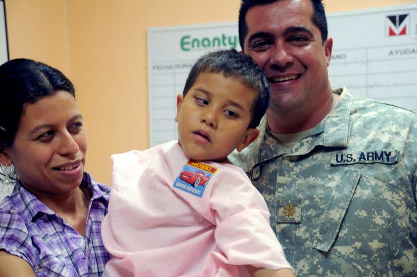 SOTO CANO AIR BASE, Honduras -- Just prior to his surgery, a young patient suffering from strabismus leans toward the voice of Maj. Jorge Cintron, JTF-Bravo Civil Affairs director, Feb. 2. JTF-Bravo was supporting a week-long opthamology Medical Readiness Training Exercise in Choluteca, which successfully restored vision to 200 Hondurans. JTF-Bravo is committed to full partnerships with Central American governments in training and missions to support security, stability and prosperity throughout the region. (U.S. Air Force photo/Staff Sgt. Kimberly Rae Moore)