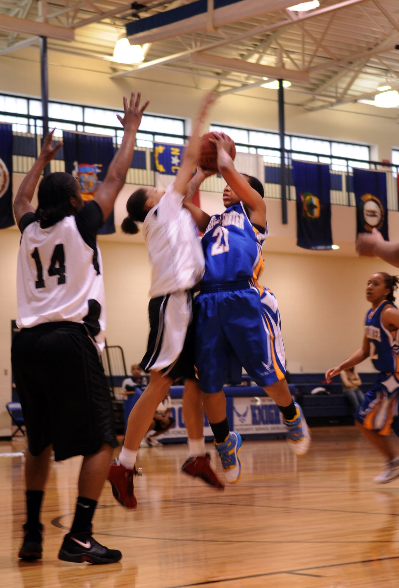 MOODY AIR FORCE BASE, Ga. -- Curtiesa Franklin of the “Maxwell-Gunter” female varsity basketball team from Maxwell Air Force Base, Ala., shoots as Ashley Searcy of Moody’s “Lady Knights” attempts to block the shot Feb. 5. Franklin ended up drawing the foul and received two free throw attempts. (U.S. Air Force photo/Airman 1st Class Douglas Ellis)(RELEASED)
