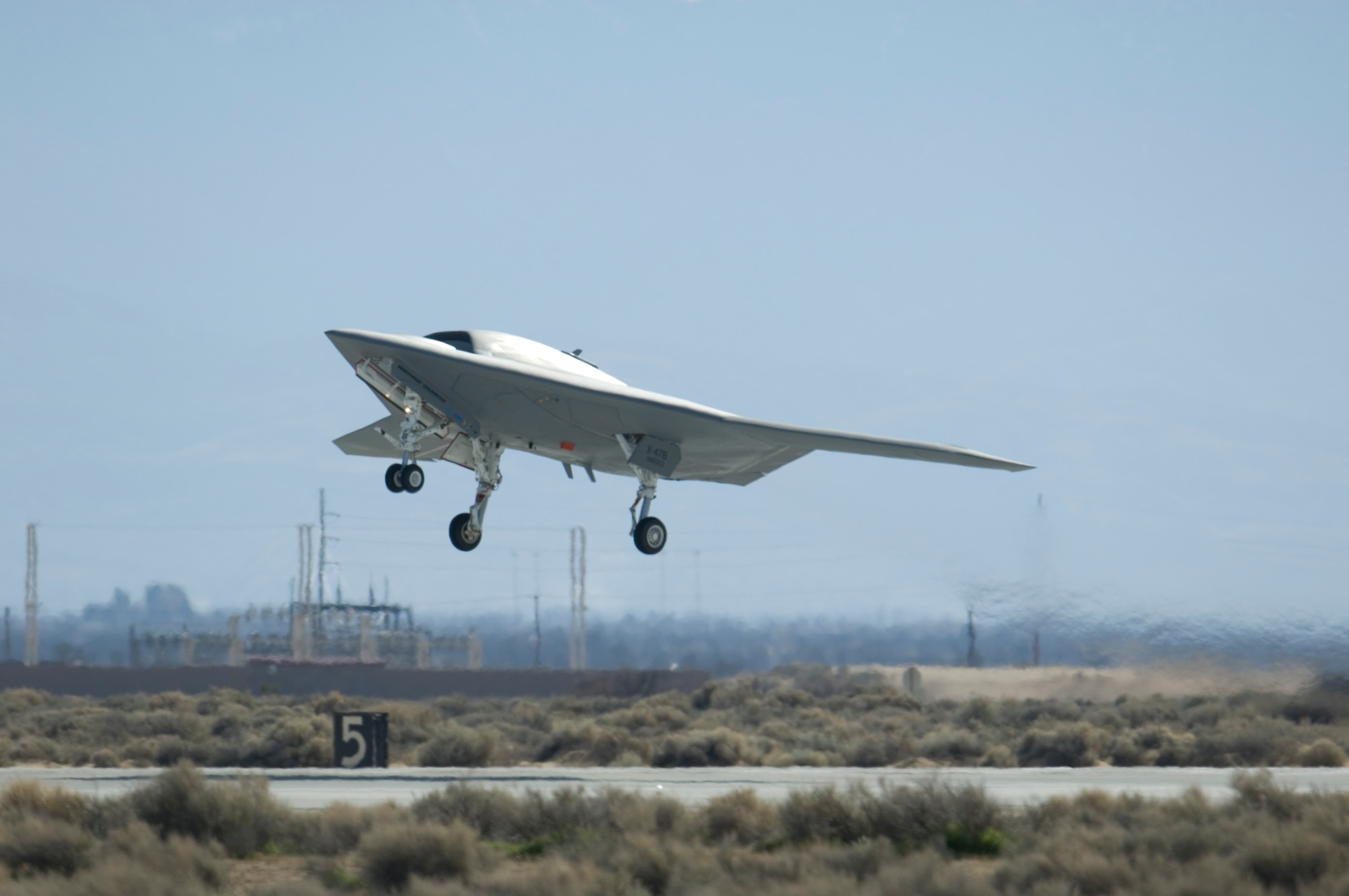 A U.S. Navy X-47B Unmanned Combat Air System Demonstration aircraft takes off and flies for the first time Feb. 4.  The Northrop Grumman built aircraft flew for 29 minutes during the flight test. (Air Force photo by Rob Densmore) 