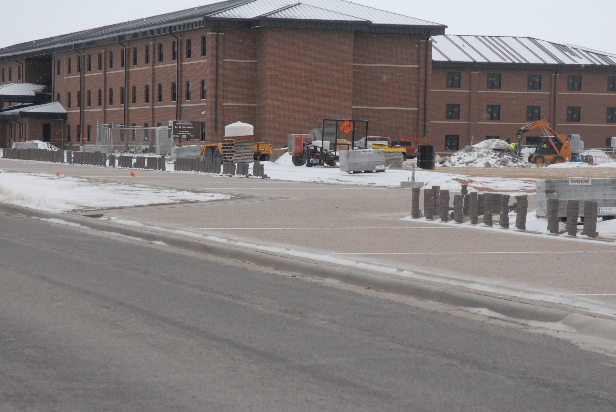GOODFELLOW AIR FORCE BASE, Texas -- The new dormitory at Apache Trail and Valiant Street is in the final phases and construction trucks are currenlty delivering equipment.  Be careful when travelling along Valiant Street past Apache Trail.  A new troopwalk is also being installed along Valiant Street on both sides of Kearney Boulevard. Slow down when approaching that intersection and travelling along Valiant Street. (U.S. Air Force photo/Connie Hempel)