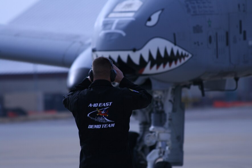 A crew chief from the A-10 East Demonstration Team marshalls in a "Warthog" after a practice flight at Langley Air Force Base, Va., Feb. 1. (U.S. Air Force photo by Justin R. Oakes)