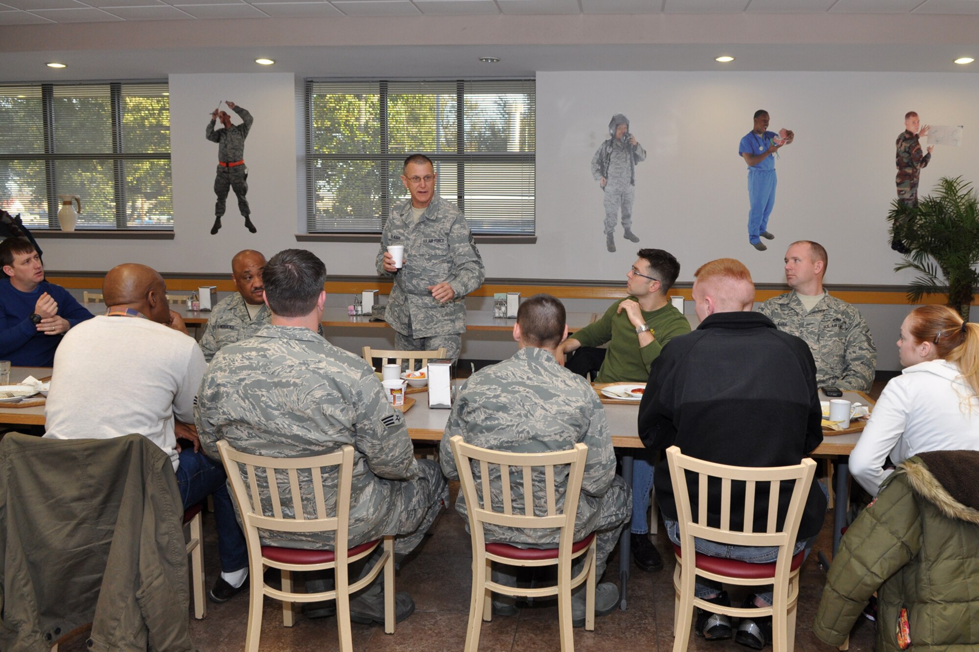 Chief Master Sgt. Keith St. Aubin, command chief, 307th Bomb Wing, interacts with Airmen newly assigned  to the wing at a welcoming breakfast in the dining facility on Barksdale Air Force Base, La., during the Unit Assembly Training weekend Feb. 6, 2011. The “Newcomers Breakfast,” which is held Sunday mornings of each monthly UTA, is an opportunity for the new Airmen to sit down for a face-to-face meeting with their new wing commander and command chief at the beginning of a career here at Barksdale. One of Chief St. Aubin’s duties as the 307th BW command chief is to advise the Commander on matters influencing the health, morale, welfare and effective utilization of more than 1,300 Reserve enlisted members of the wing.  Meeting with new Airmen in a smaller informal setting at the beginning of their careers here, leads to a more open exchange of ideas and concerns between all of the ranks. It also allows seniors leaders who attend the monthly event to set the tone for the new Airmen, who are joining what has been a winning team for years. (U.S. Air Force photo/Tech. Sgt. Jeff Walston)
