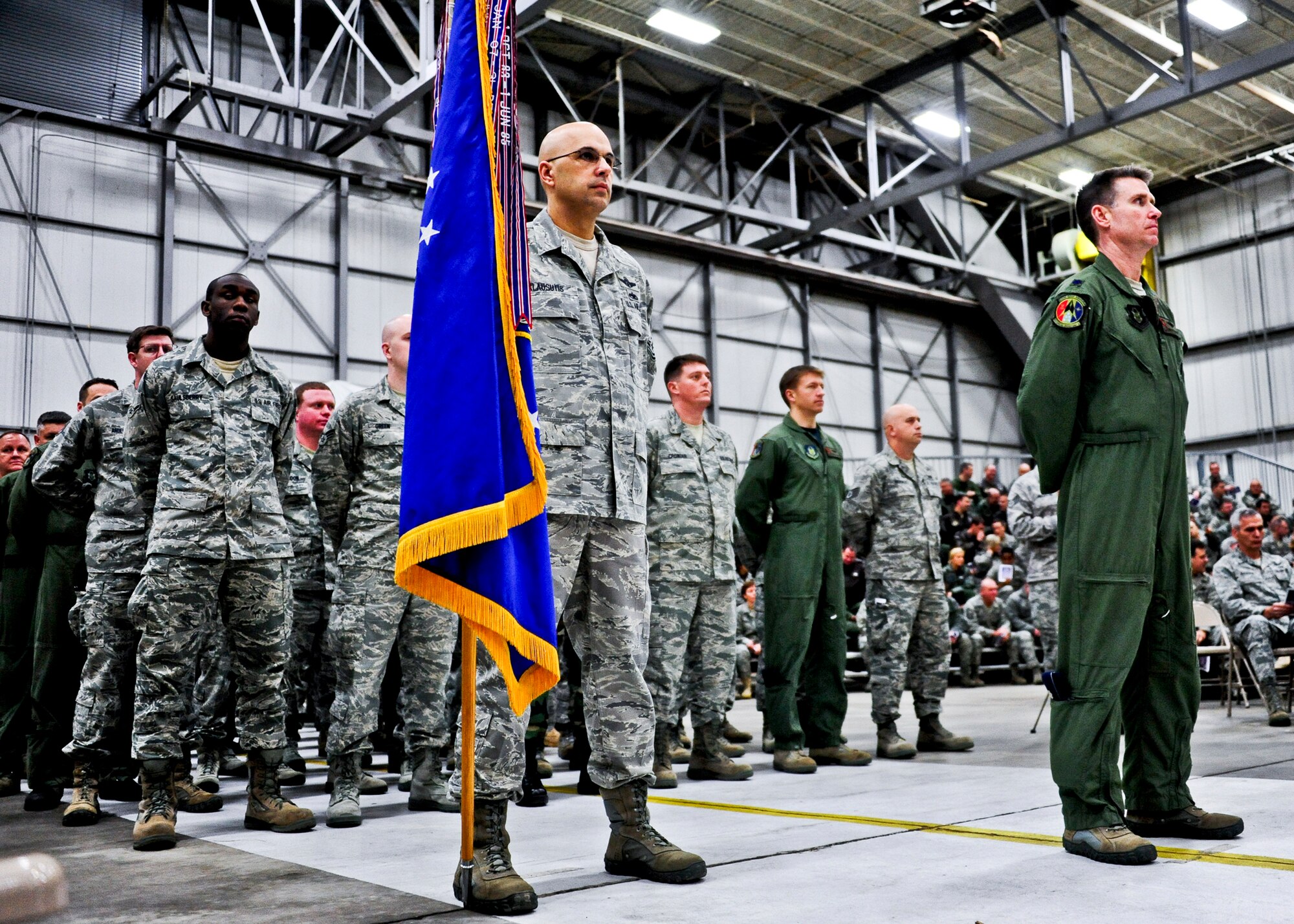 Chief Master Sgt. Michael Klausutis, 919th Special Operations Wing command chief, left, and Lt. Col. Destry Rogers, commander of troops, stand at parade rest during the wing's assumption of command ceremony Feb. 5 at Duke Field, Fla. Col. Andy Comtois assumed command of the Air Force Reserve’s most decorated wing in the formal ceremony in front of hundreds of Airmen and distinguished visitors.    (U.S. Air Force photo/Tech. Sgt. Samuel King Jr.)