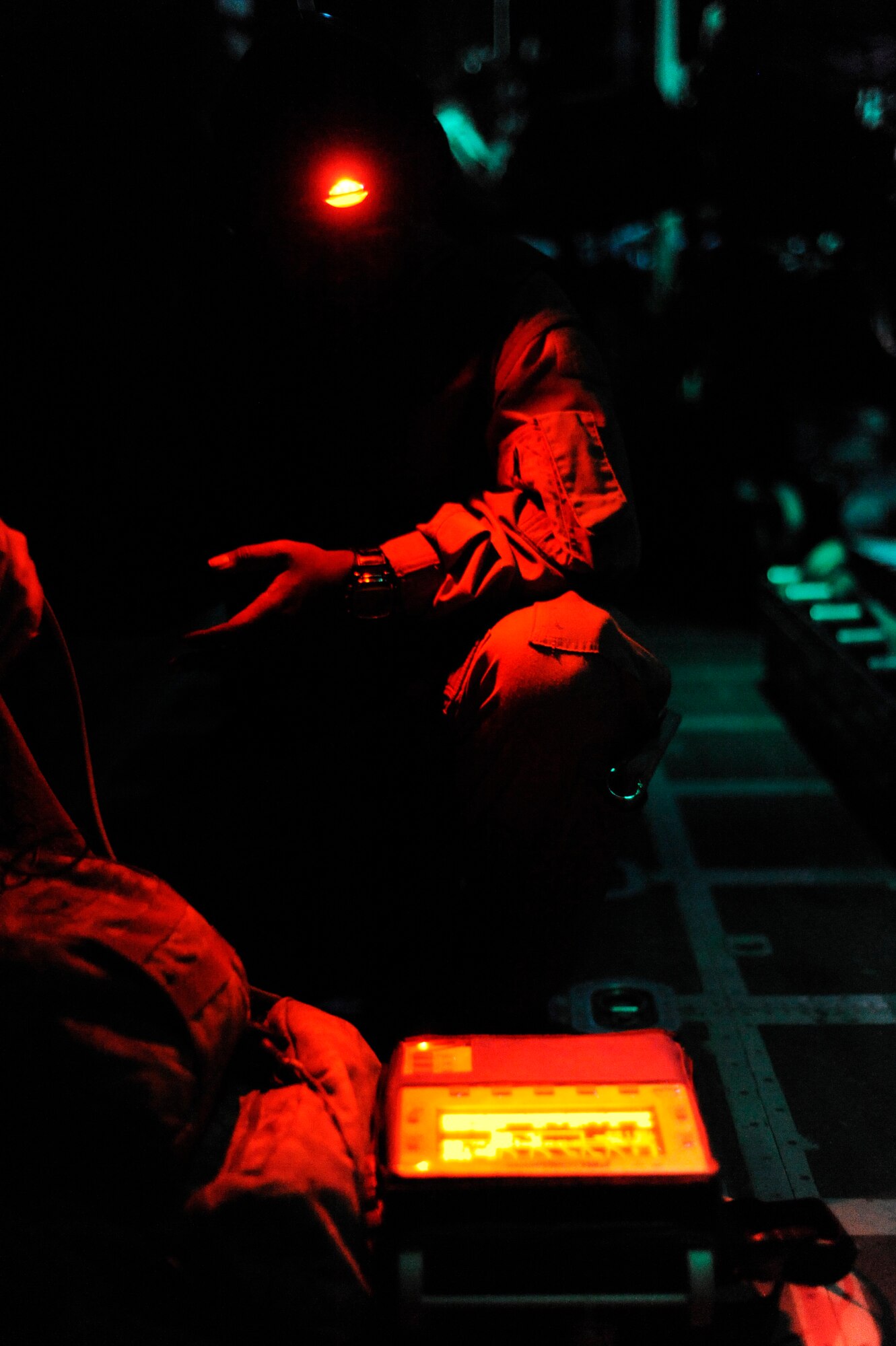 U.S. Air Force Staff Sgt. Candice Hunter, 455th Expeditionary Aeromedical Evacuation Flight, checks a patient's blood pressure aboard a C-130H Hercules flying over Afghanistan during a medical evacuation mission in support of Operation Enduring Freedom, Jan. 7, 2011.  C-130s are able to land on runways that many other fixed wing aircraft are unable to, making them invaluable when moving patients in austere locations. (U.S. Air Force photo by Staff Sgt. Eric Harris) 