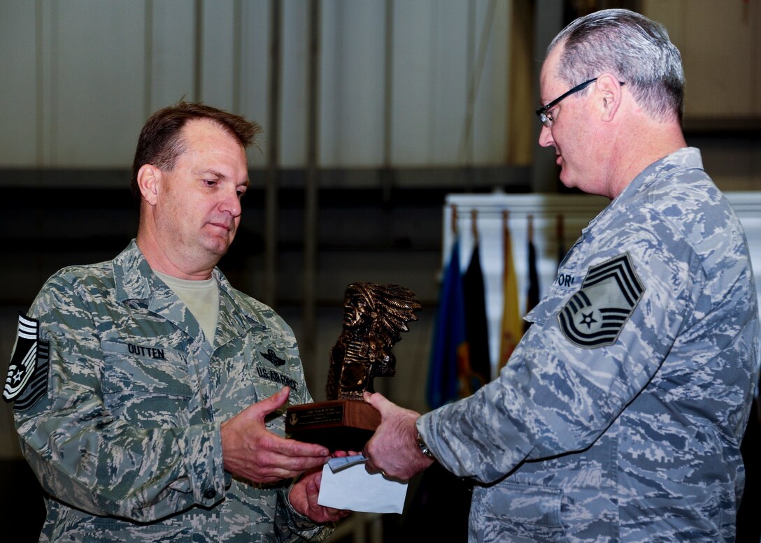 Chief Master Sgt. Tyler Outten, 5th Special Operations Squadron, (left) receives the chief bust from Chief Master Sgt. Jeff Fitzpatrick, 919th Maintenance Squadron, as the 919th Special Operations Wing’s newest chief during his induction ceremony Feb. 5 at Duke Field, Fla.  (U.S. Air Force photo/Tech Sgt. Samuel King Jr.)