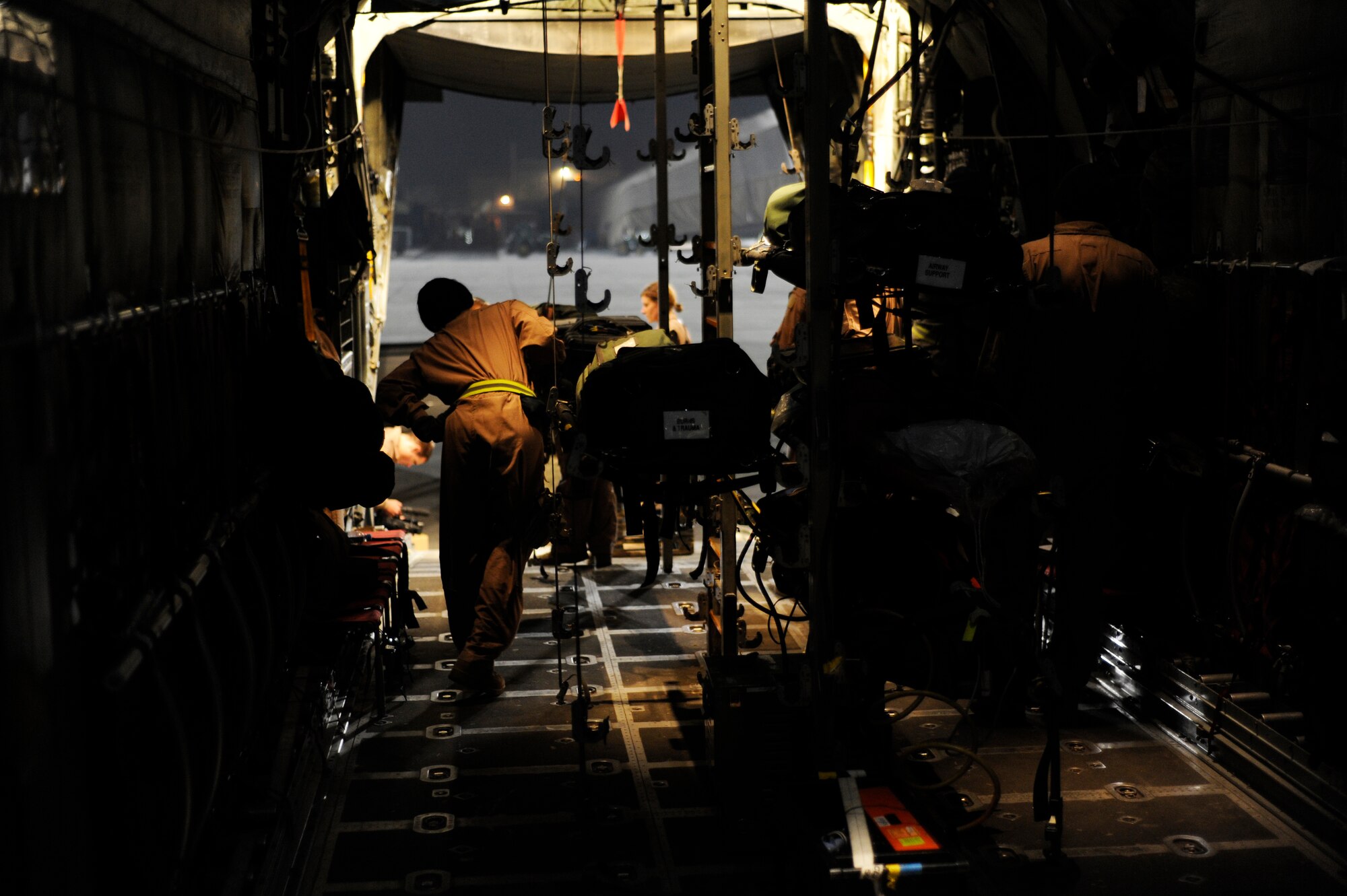 A U.S. Air Force C-130H Hercules aircrew from the 774th Expeditionary Airlift Squadron and medical personnel from the 455th Expeditionary Aeromedical Evacuation Flight prepare for medical evacuation operations in support of Operation Enduring Freedom at Bagram Airfield, Afghanistan, Jan. 7, 2011.  C-130s are able to land on runways that many other fixed wing aircraft are unable to, making them invaluable when moving patients in austere locations.  (U.S. Air Force photo by Staff Sgt. Eric Harris) 