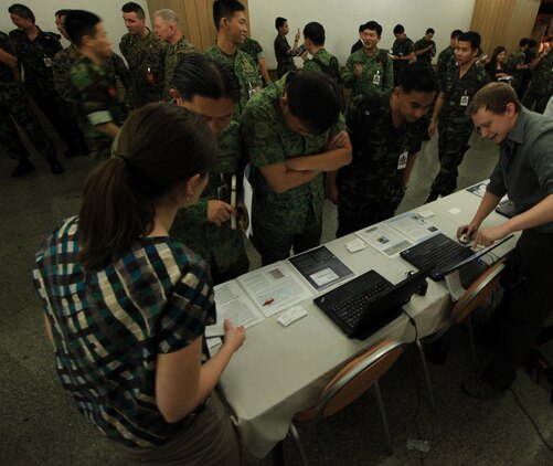 Dignitaries from countries participating Exercise Cobra Gold 201 view demonstrations of 20 technologies and equipment after the exercise's opening ceremony in Chiang Mai Feb. 7, 2011. Cobra Gold provides unique and dynamic training oppur-tunities for participating military partners.