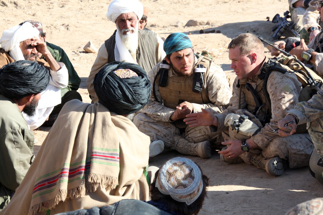 U.S. Marine Corps Capt. Brian Donlon, company commander of Company I, Battalion Landing Team 3/8, 26th Marine Expeditionary Unit, Regimental Combat Team 8, holds a shura with residents of South Gavmishi, Helmand province, Afghanistan, Feb. 8, 2011. Capt Donlon called the shura to address concerns and inform residents of the Marines' intent to assist local civilians and disrupt insurgent activities in the area. Elements of 26th Marine Expeditionary Unit deployed to Afghanistan to provide regional security in Helmand province in support of the International Security Assistance Force.