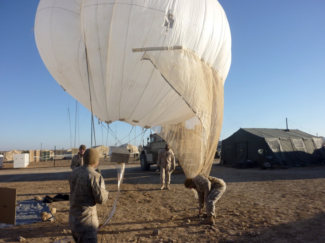 U.S. Marines attached to Battalion Landing Team 3/8, Regimental Combat Team 8, prepare the lofted communication balloon for tethered deployment at Combat Outpost Ouellette, Helmand province, Afghanistan, Feb. 8, 2011. This was the first use of lofted comms in support of Marine Corps operations. 26th MEU Marines have tested and refined the system in exercises since 2009. Elements of 26th Marine Expeditionary Unit deployed to Afghanistan to provide regional security in Helmand province in support of the International Security Assistance Force.