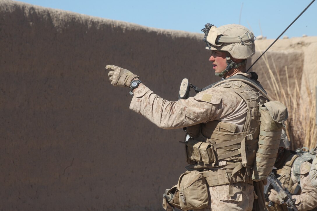 U.S. Marine Corps Lance Cpl. Kevin W. Roe, a team leader with 2nd Platoon, Company L, Battalion Landing Team 3/8, 26th Marine Expeditionary Unit, Regimental Combat Team 8, issues directions to the rest of his team during a patrol through Chineh, Helmand province, Afghanistan, Feb. 8, 2011. Elements of the 26th Marine Expeditionary Unit deployed to Afghanistan to provide regional security in Helmand province in support of the International Security Assistance Force.