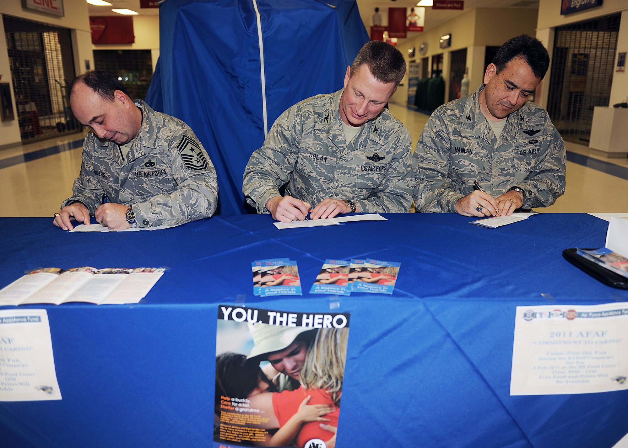 KUNSAN AIR BASE, Republic of Korea -- 8th Fighter Wing leadership signs Air Force Assistance Fund donation forms here Feb. 8, 2010. The AFAF was established to raise funds for the charitable affiliates that provide support to the Air Force family. The AFAF campaign runs at Kunsan until March 18. (U.S. Air Force photo/Senior Airman Ciara Wymbs) 