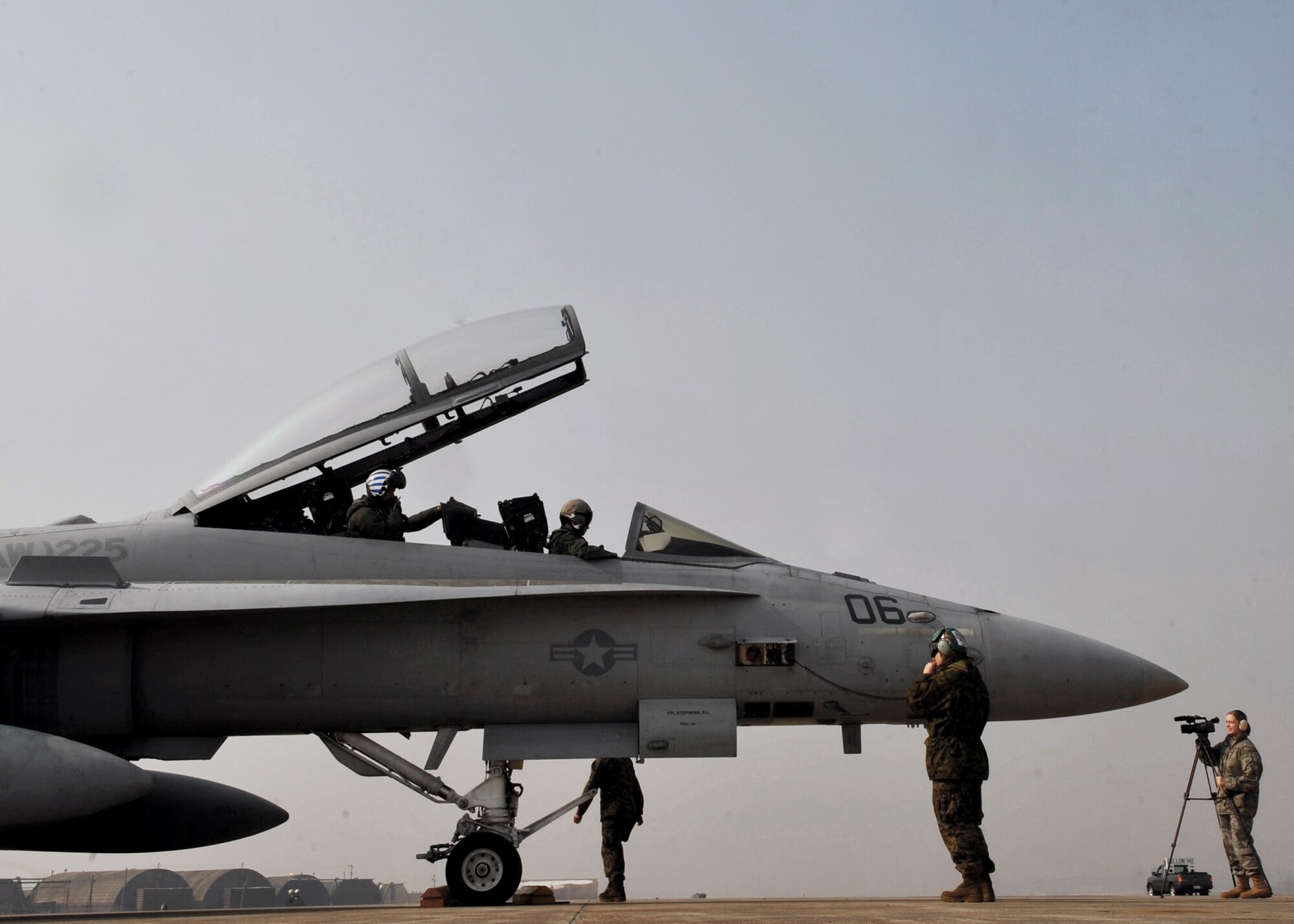 Marines from the Marine Fighter Attack Squadron 225 inspect an F-18 Hornet Feb. 2, 2011, at Osan Air Base, South Korea.The  (U.S. Air Force photo/Senior Airman Evelyn Chavez) 
