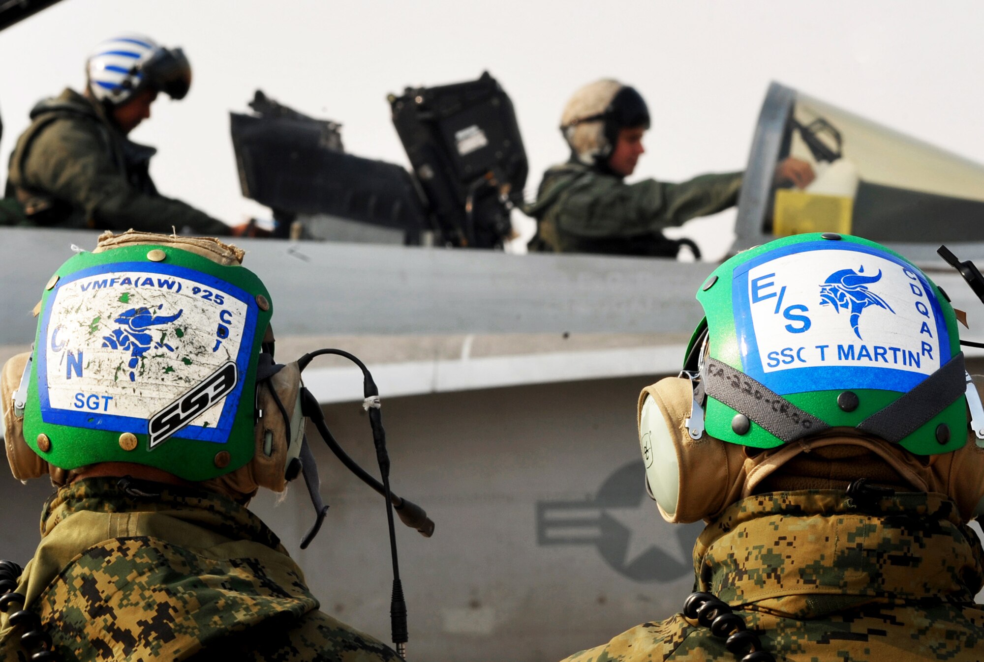 Marine pilots and maintainers from the Marine Fighter Attack Squadron 225 prepare an F-18 Hornet prior to takeoff Feb. 2, 2011, at Osan Air Base, South Korea. (U.S. Air Force photo/Senior Airman Evelyn Chavez) 