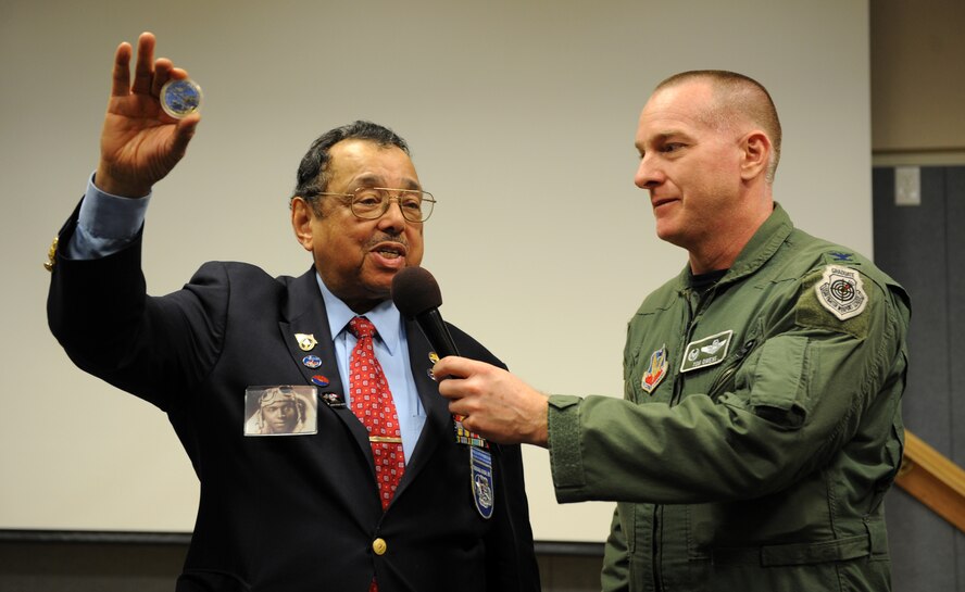 2nd Lt. William M. Wheeler, a Tuskeegee Airman, accepts a 106th Rescue Wing coin from Col. Thomas J. Owens II after giving his keynote speech during the Black History Month celebration at the Wing Auditorium at F.S. Gabreski Airport, Westhampton Beach, N.Y. on February 8, 2011. 2nd Lt. William M. Wheeler was the keynote speaker for the event.

(Official U.S. Airforce photo/SSgt. Marcus P. Calliste/ released)