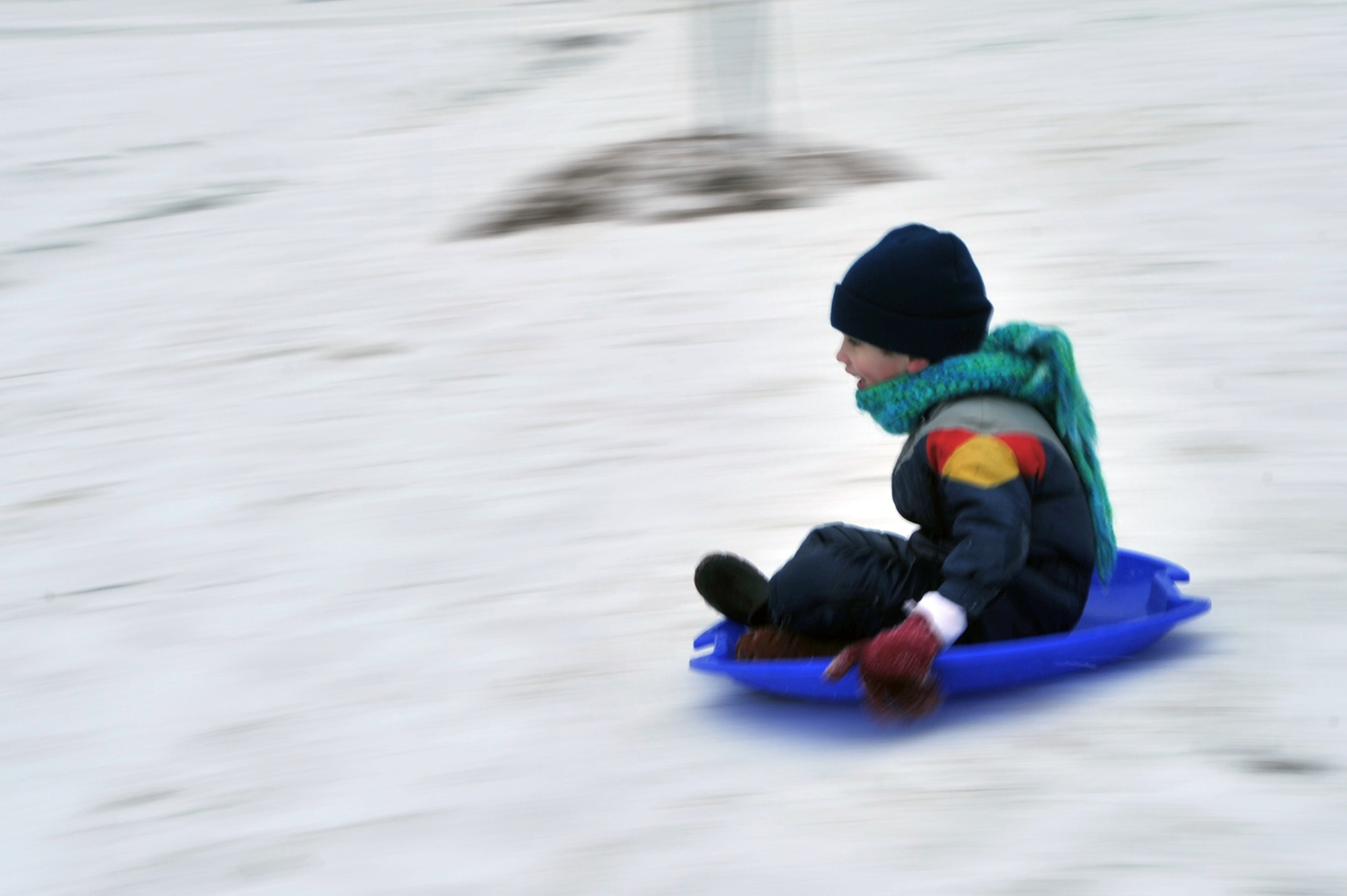 Case Ostrom, 5, slides down a hill in his back yard on Barksdale Air Force Base, La., Feb. 4. The Ostrom's enjoy their snow day with sledding and hot chocolate. (U.S. Air Force photo/Airman 1st Class Micaiah Anthony)(Released)