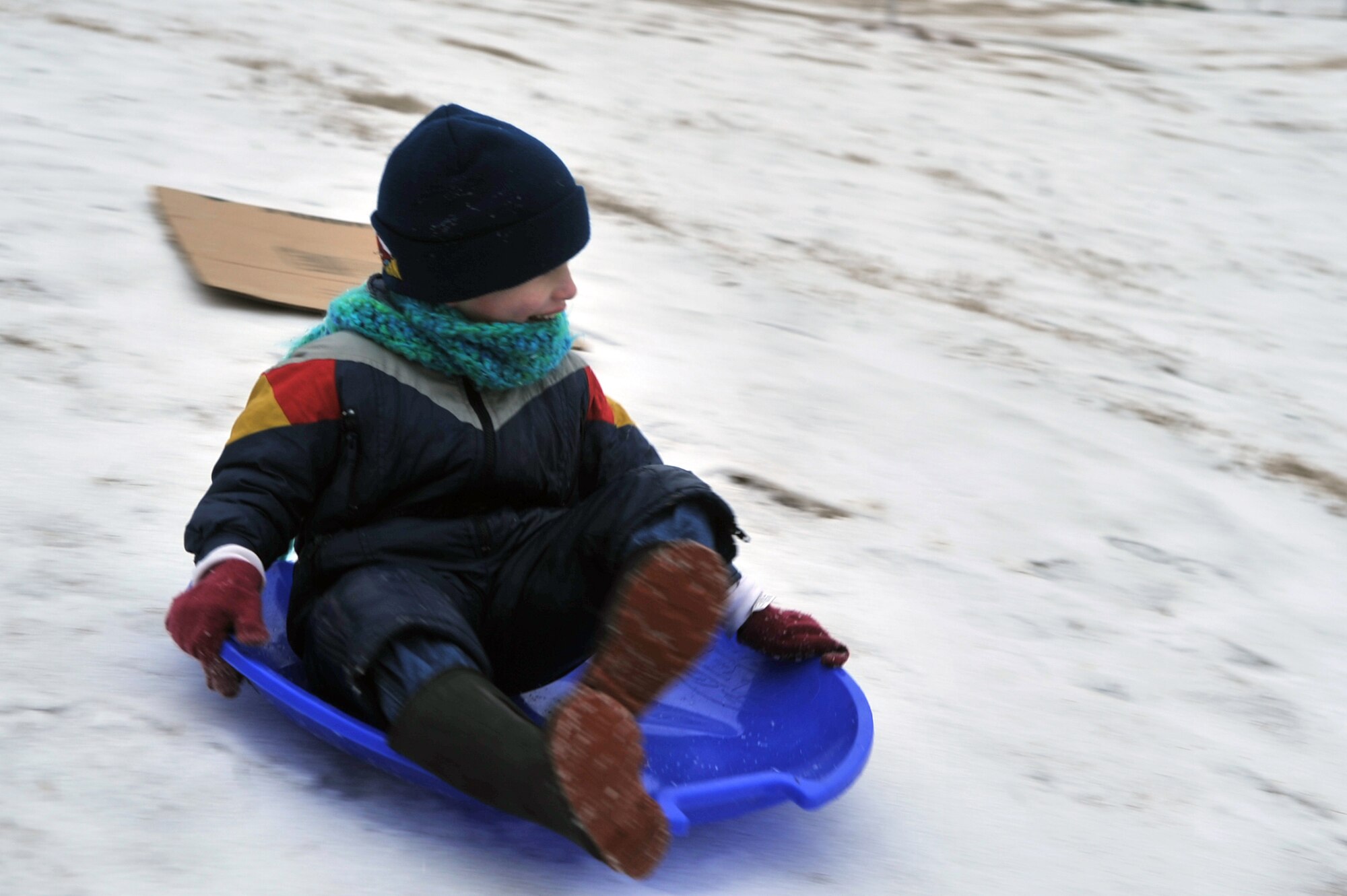 Case Ostrom, 5, slides down a hill in the Liberty Heights housing area on Barksdale Air Force Base, La., Feb. 4. Schools in the Shreveport/Bossier area were closed due to inclement weather. (U.S. Air Force photo/Airman 1st Class Micaiah Anthony)(Released)