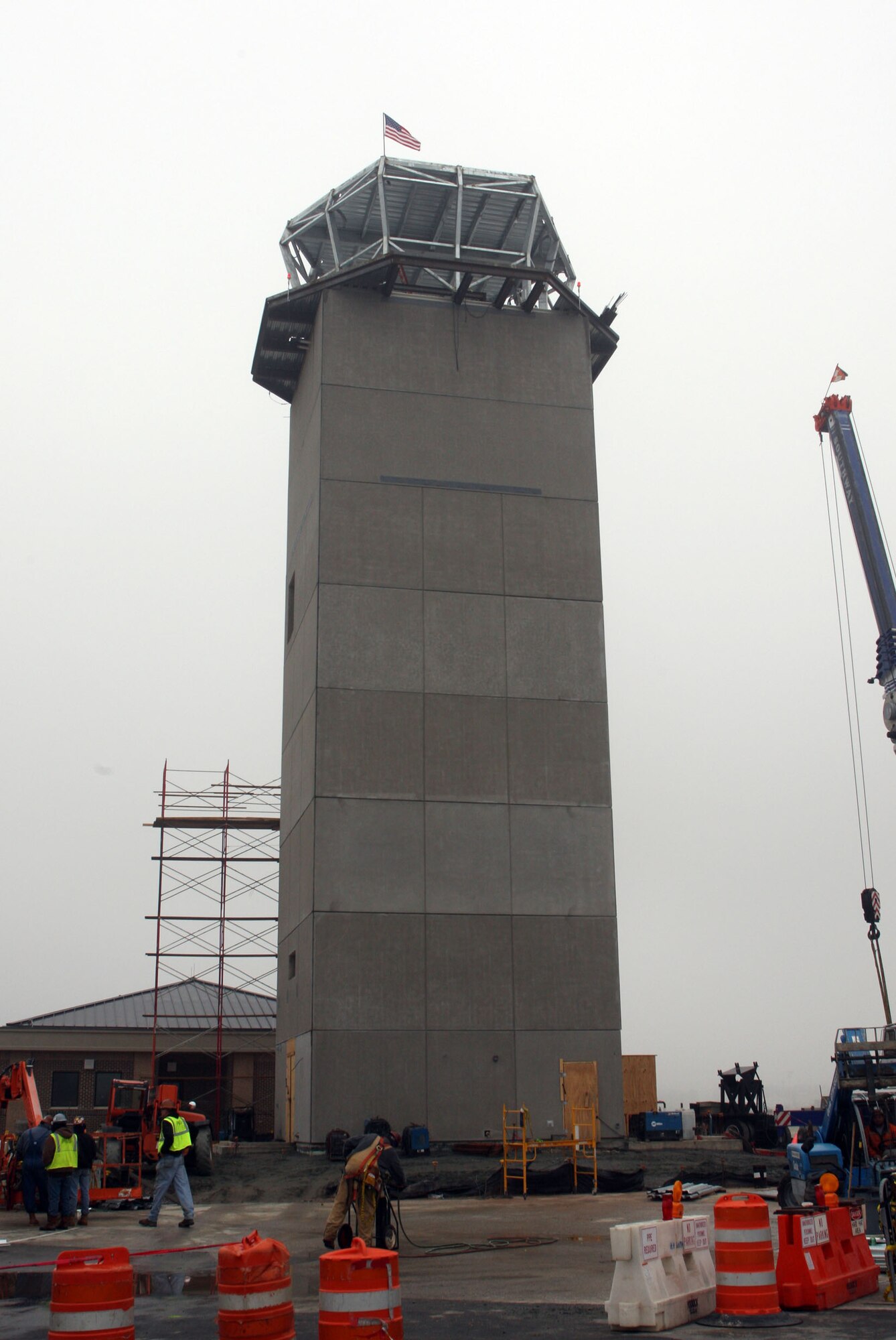 Construction crews successfully lift the cab frame for the new Dobbins control tower main structure here Feb 1. (U.S. Air Force Photo/Don Peek)