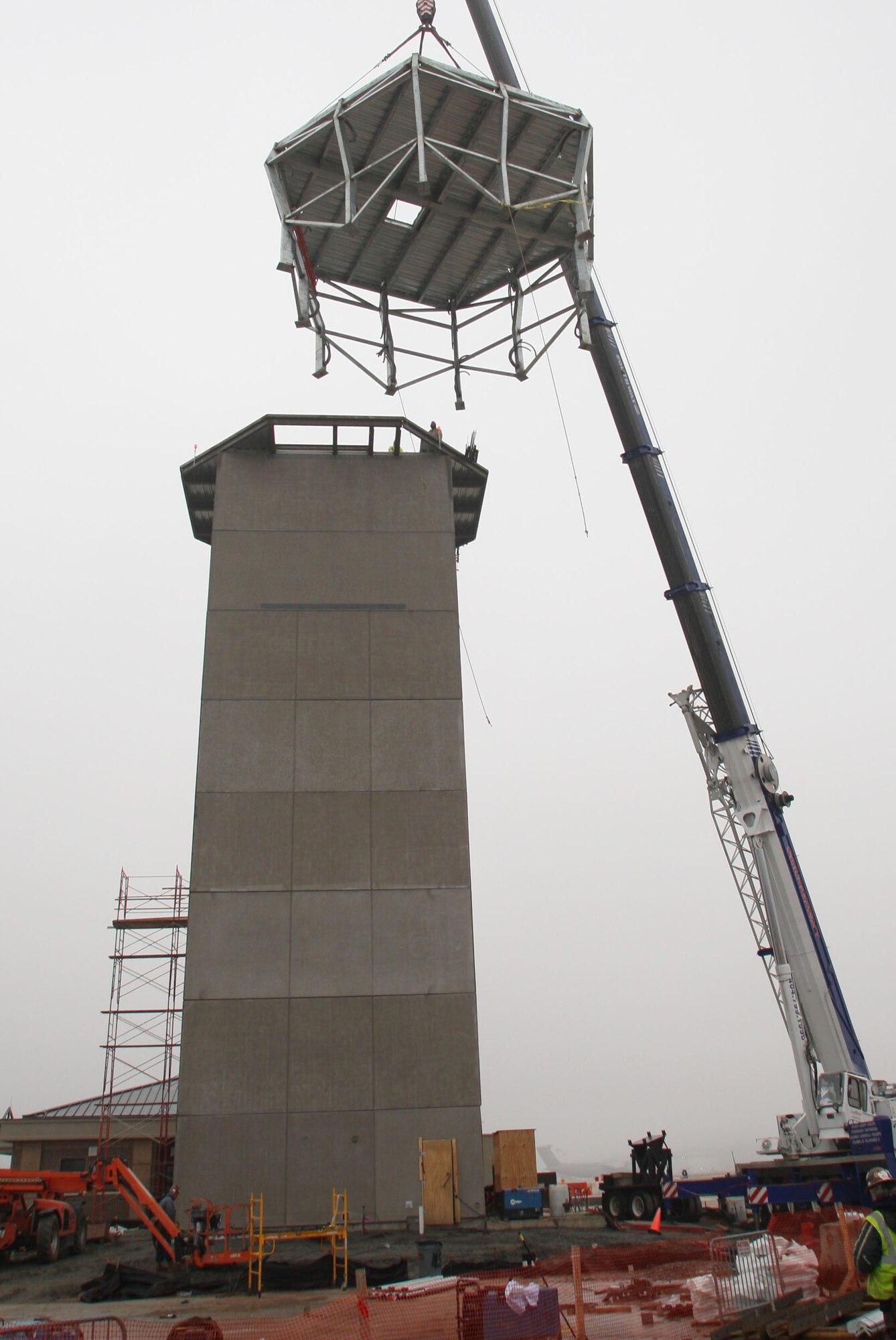 The frame of the new control tower cab is lifted into place here Feb 1. (U.S. Air Force Photo/Don Peek)
