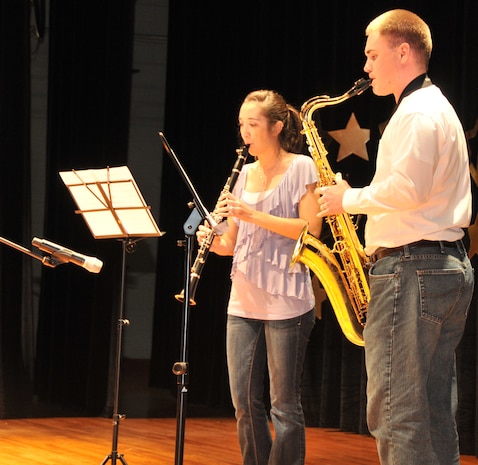 Airman 1st Class Jeffery Egolf and wife Danielle, play a Super Mario Bros. theme song during the annual 2011 “You Got Talent” Family and Teen Talent contest Feb. 5 at the air base theater. The show was produced by Youth Programs in conjunction with the Nell Buckley Performing Arts Series.