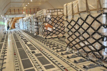 Approximately 500 pallets containing Low-Cost Low-Velocity parachutes are transported through Joint Base Charleston to Afghanistan each month. Parachutes are transported by C-17s, C-5s and contracted 747s. (U.S. Air Force photo by Airman Jared Trimarchi)