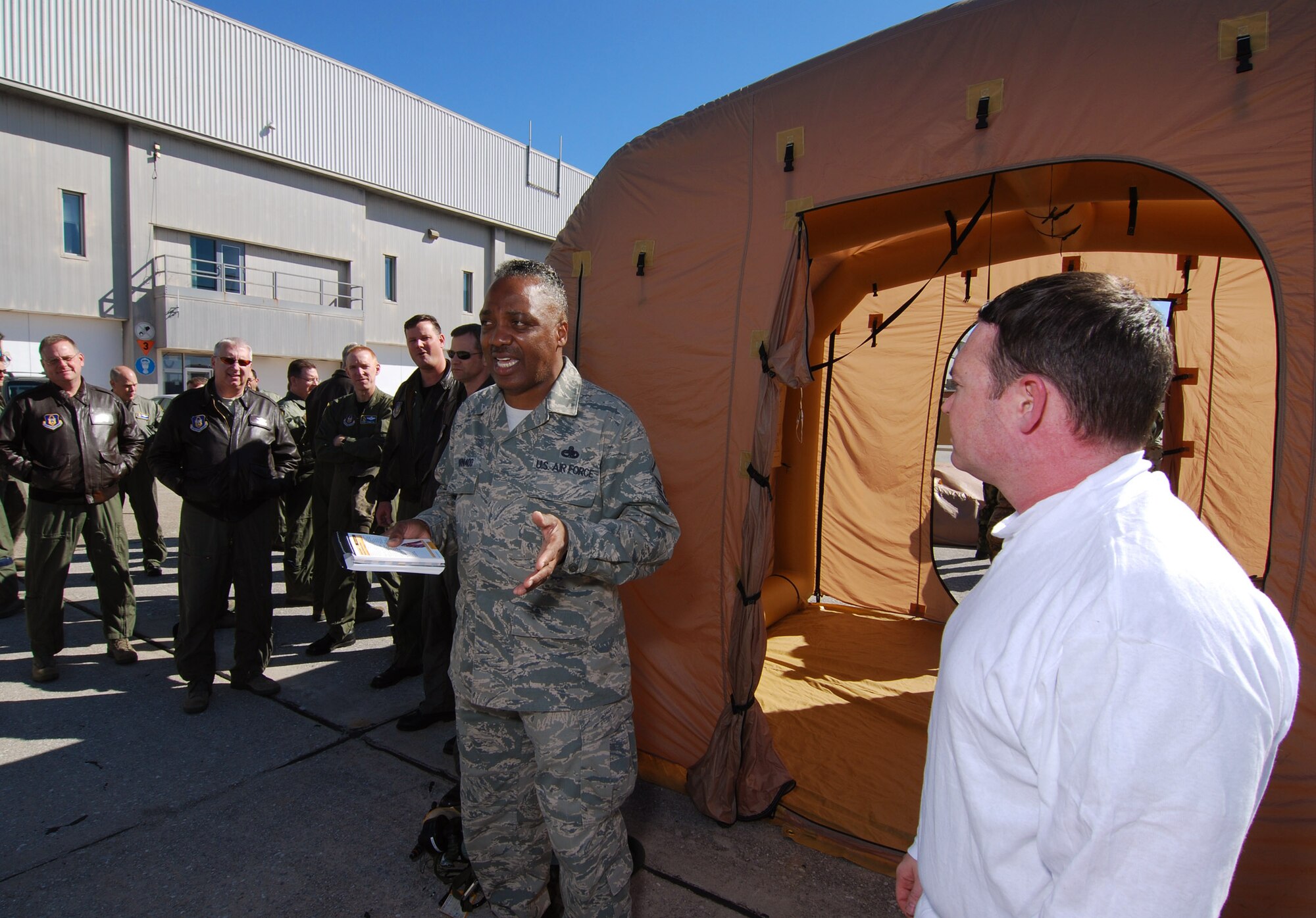 Master Sgt. Mike Varnado, Aircrew Flight Equipment Training NCOIC, gives a closing brief to 94th Airlift Wing aircrew members on aircrew decontamination procedures, 6 Feb.  A lucky couple of airmen got to dress out and go through the stations as the rest of the class observed for the refamiliarization training.  The training took them from start to finish through an Air Force decontamination line and provided good insight as to what to they will experience in the process.  (U.S.  Air Force photo/ Brad Fallin)