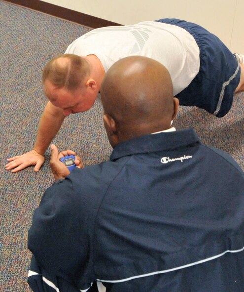 Chief Master Sgt. Rich Sherman, 436th Security Forces Squadron superintendant, performs push-ups during a fitness assessment Feb 3, 2011, at Dover AFB. (U.S. Air Force photo/Airman 1st Class Jacob Morgan)