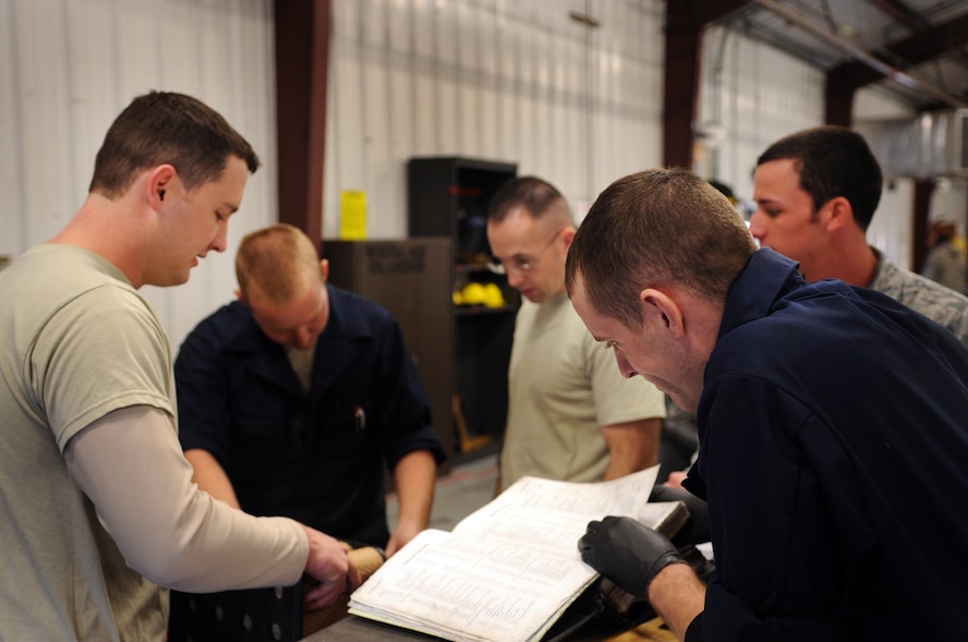 MOODY AIR FORCE BASE, Ga. -- Members of the 23rd Equipment Maintenance Squadron air ground equipment flight look through technical orders Feb. 8. The members were gathering information on performing inspections. (U.S. Air Force photo/Airman 1st Class Douglas Ellis)(RELEASED)

