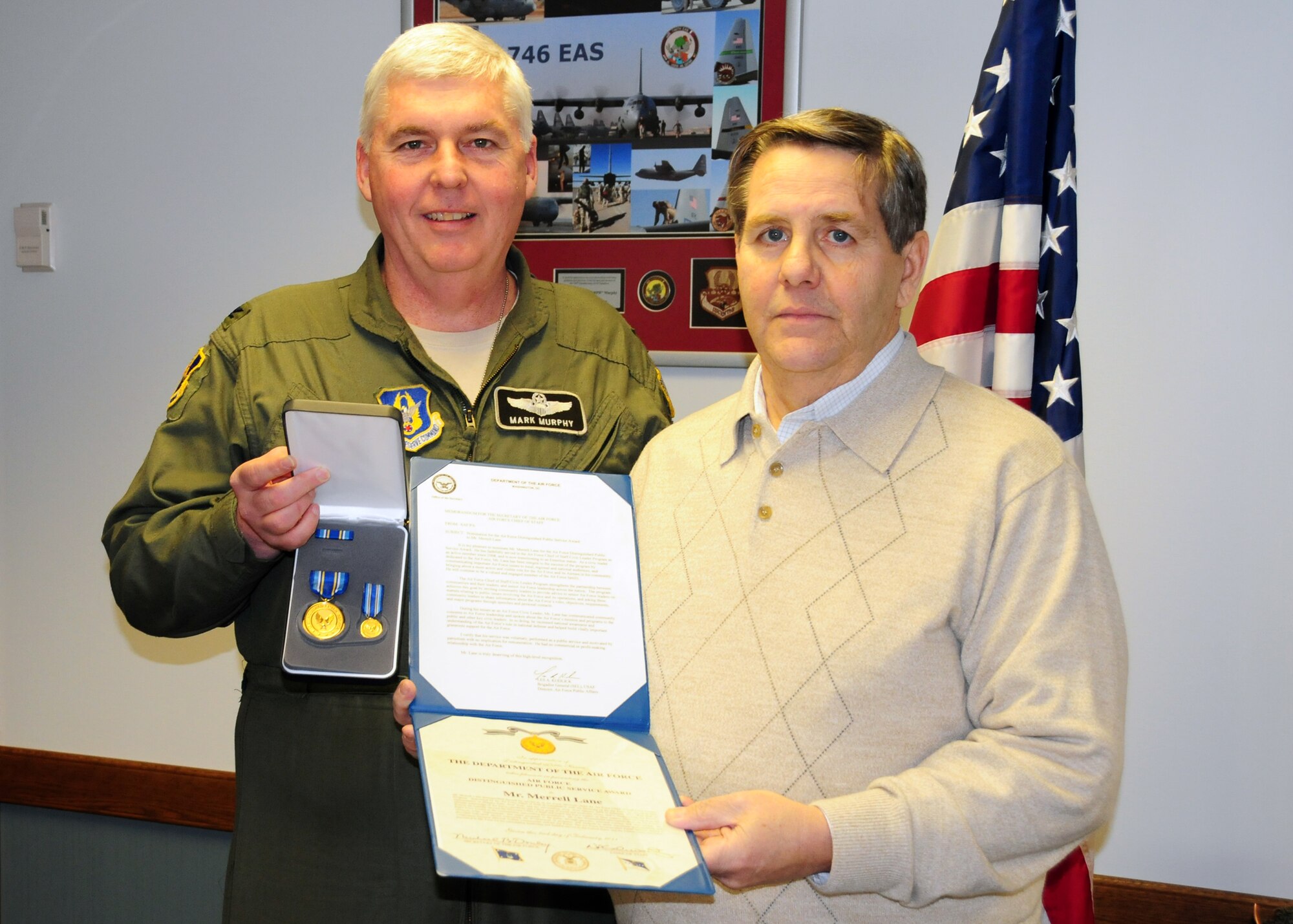 NIAGARA FALLS AIR RESERVE STATION, N.Y- Col. Mark Murphy, 914th Airlift Wing Vice Commander congratulates Mr. Merrell Lane, President of the Niagara Military Affairs Council (NIMAC) upon receiving the Air Force Distinguished Public Service Award presented to Mr. Lane by General Norton Schwartz, Air Force Chief of Staff earlier this month at the pentagon.