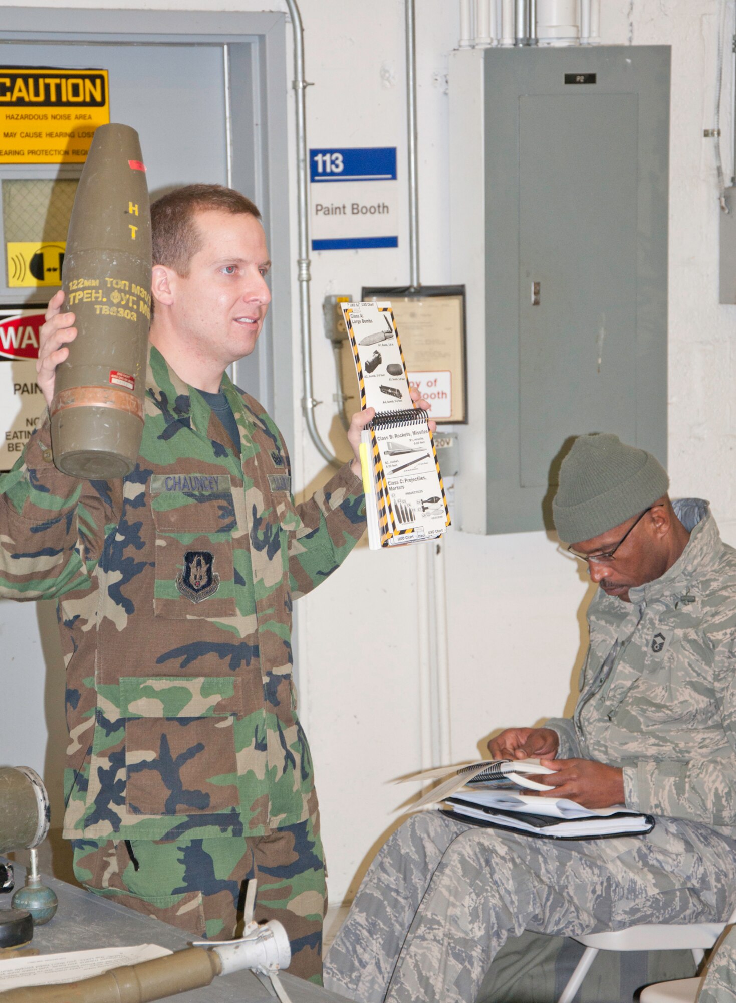 JOINT BASE ANDREWS, Md. -- Tech. Sgt. Michael Chauncey, 459th Civil Engineering Squadron, describes how to identify a Class C1 mortar in a training class in Hangar 10 here Feb. 4.  Sergeant Chauncey joined other 459 ARW instructors in teaching 14 different Ability to Survive and Operate and readiness training courses over a two-day period. The training prepares 459 ARW Airmen for future exercises and an upcoming Operational Readiness Inspection. (U.S. Air Force photo/Staff Sgt. Sophia Piellusch)