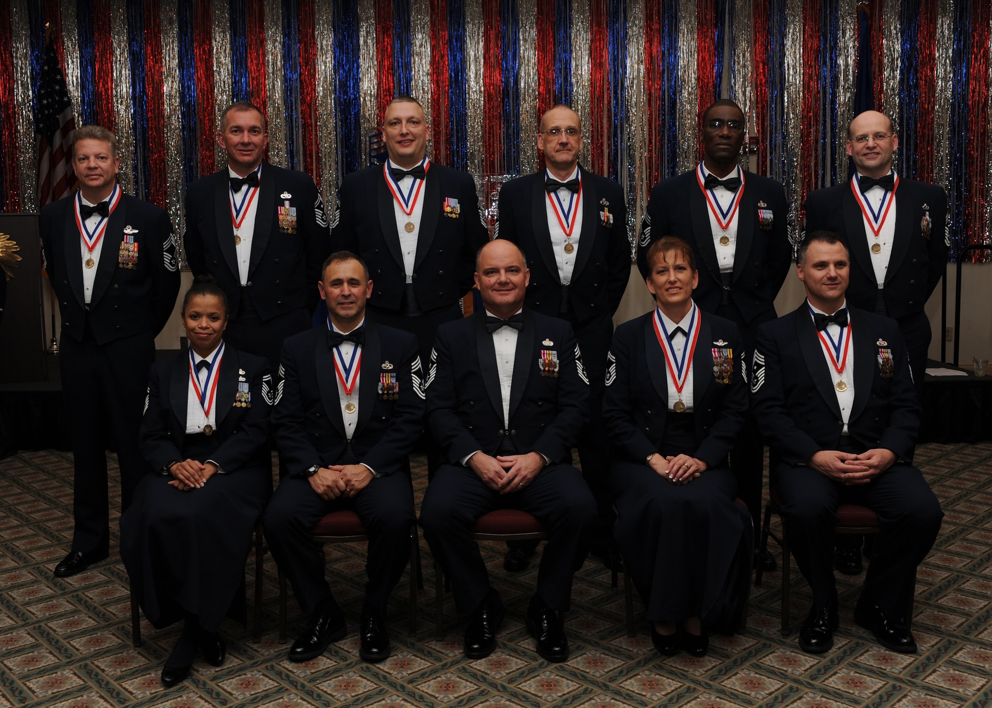 Ten of Team Charleston's 12 chief master sergeant inductees were in attendance at the Joint Base Charleston's chief induction ceremony here, Feb. 5. Chief master sergeants make up one percent of the Air fForce's enlisted force. Not pictured due to deployment are Chief Master Sergeant Selects Michael Gibson and Jeffrey Leeson. (I.S. Air Force photo/Senior Airman Katie Gieratz)
