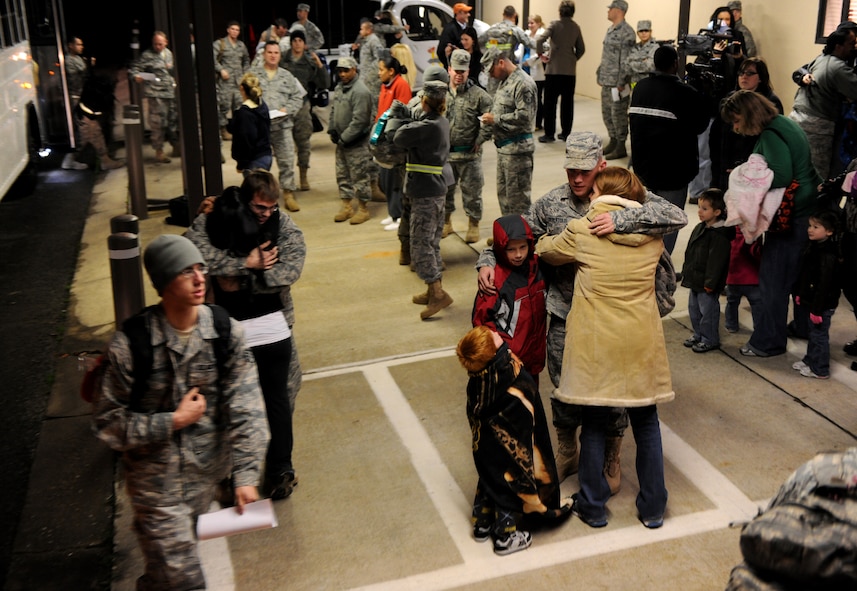 MOODY AIR FORCE BASE, Ga.-- Personnel from the 723rd Aircraft Maintenance Squadron were greeted by their significant others as they unload buses after returning from a four-month deployment Feb. 8. The 23rd AMXS was responsible for maintaining search and rescue aircraft while being deployed to Joint Base Balad, Iraq. (U.S. Air Force photo/Airman 1st Class Benjamin Wiseman)(RELEASED)