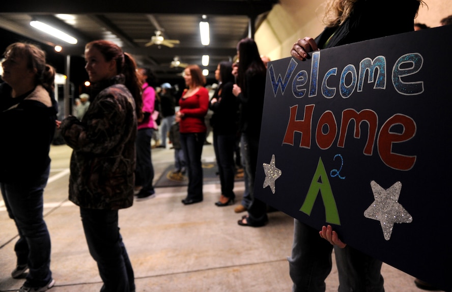 MOODY AIR FORCE BASE, Ga.-- Several “Welcome Home” signs were on display as members of the 23rd Maintenance Group arrive at their squadron building after returning from a deployment Feb. 8. More than 50 members of the 723rd Aircraft Maintenance Squadron returned after a four-month deployment to Joint Base Balad, Iraq. (U.S. Air Force photo/Airman 1st Class Benjamin Wiseman)(RELEASED)