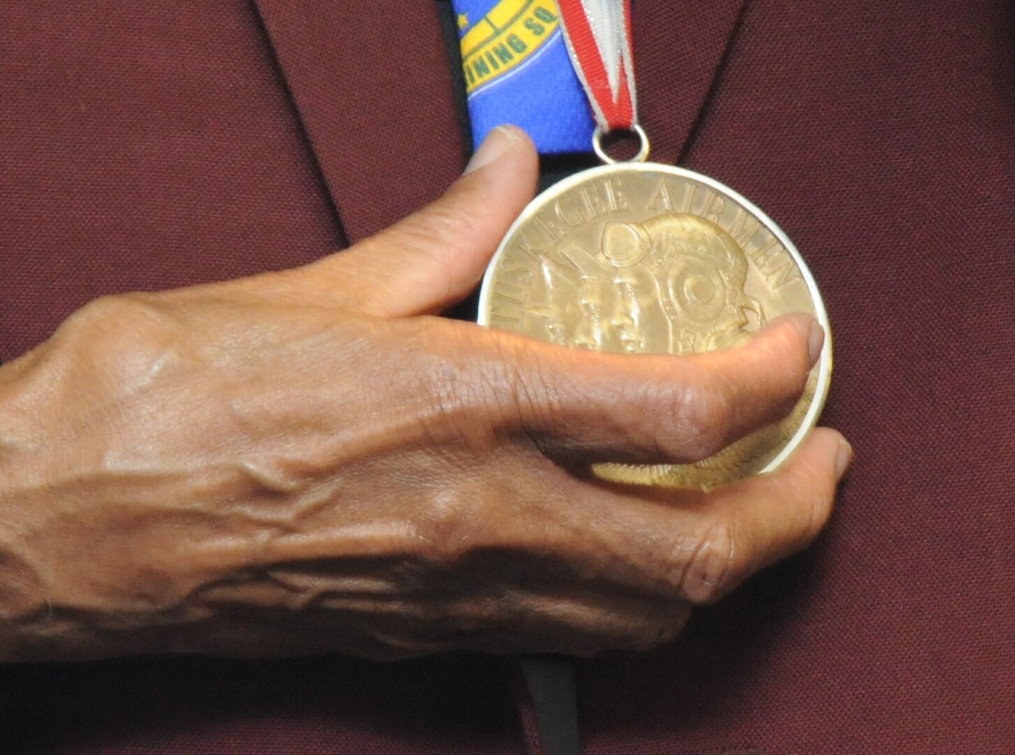 Randolph Air Force Base, Texas:  (Lt. Colonel) Dr. Granville C. Coggs, M.D., Documented Original Tuskegee Airman, Shows his Congressional Gold Medal at the Third Annual Tuskegee Heritage Breakfast.  The Beakfast is held at the 99th Flying Training Squadron on Randolph Air Force Base.  (U.S. Air Force photo/Rich McFadden)