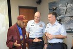 Randolph Air Force Base, Texas:  (Lt. Colonel) Dr. Granville C. Coggs, M.D.(left), Documented Original Tuskegee Airman, talks with CMSgt Steven Jones (center), 12th Flying Training Wing Command Chief and Colonel Richard Murphy, 12th Flying Training Wing Commander, at the Third Annual Tuskegee Heritage Breakfast.  The Beakfast is held at the 99th Flying Training Squadron on Randolph Air Force Base.  (U.S. Air Force photo/Rich McFadden)