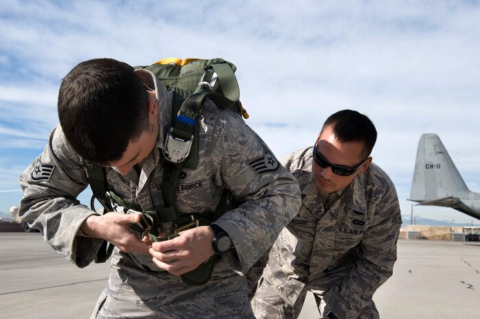 NELLIS AIR FORCE BASE, Nev.-- Staff Sgt. Derek Borough does a buddy-check on Staff Sgt. Shane Lahaie, 820th Rapid Engineer Deployable Heavy Operational Repair Squadron Engineers airborne jumpers before departing for a Red Flag mission over the Nevada Test and Training Range Feb. 4. Red Flag is a realistic combat training exercise involving the air forces of the United States and its allies. The exercise is hosted north of Las Vegas on the Nevada Test and Training Range. (U.S. Air Force photo by Senior Airman Brett Clashman)