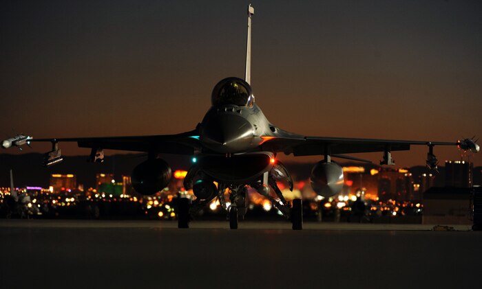 NELLIS AIR FORCE BASE, Nev.-- A F-16 Fighting Falcon from the 480th Fighter Squadron, Spangdahlem Air Base Germany, prepares to taxi out to the runway, for a night training mission over the Nevada Test and Training Range, during Red Flag 11-2, Feb. 2. Red Flag is a realistic combat training exercise involving the air forces of the united states and its allies. (U.S. Air Force photo by Airman 1st Class Daniel Hughes)