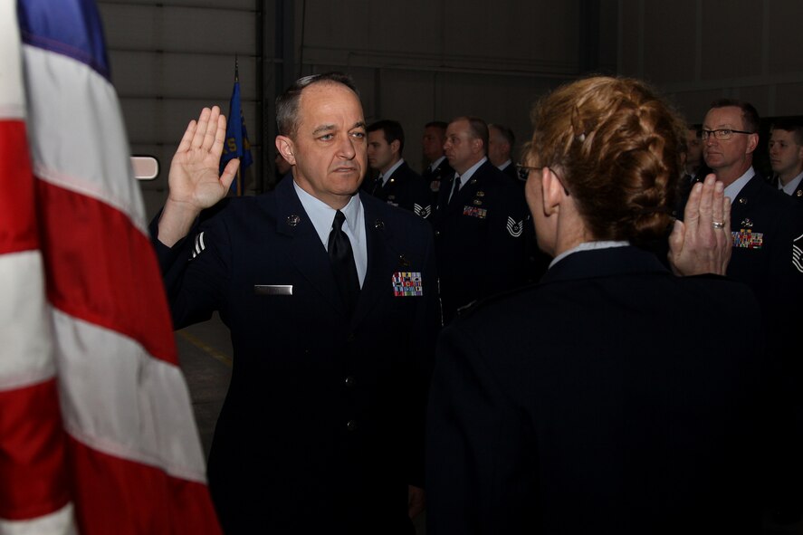 Chief Master Sgt.  Christopher Dunn, 911th Aircraft Maintenance Squadron aircraft maintenance superintendent, re-enlists in the Air Force Reserve for two more years, Feb. 6. Chief Dunn was re-enlisted by his wife Capt. Tanaka Dunn, 911th Airlift Wing process manager, on their 18th wedding anniversary. (U.S. Air Force photo/Senior Airman Joshua J. Seybert)